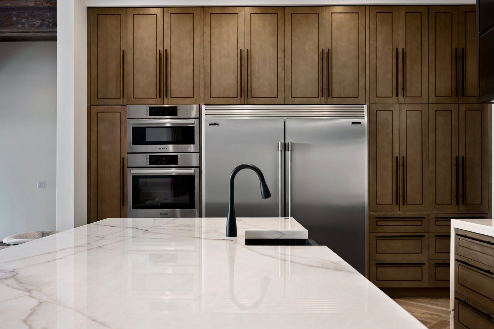 Custom residence — full-height cabinetry with integrated appliances