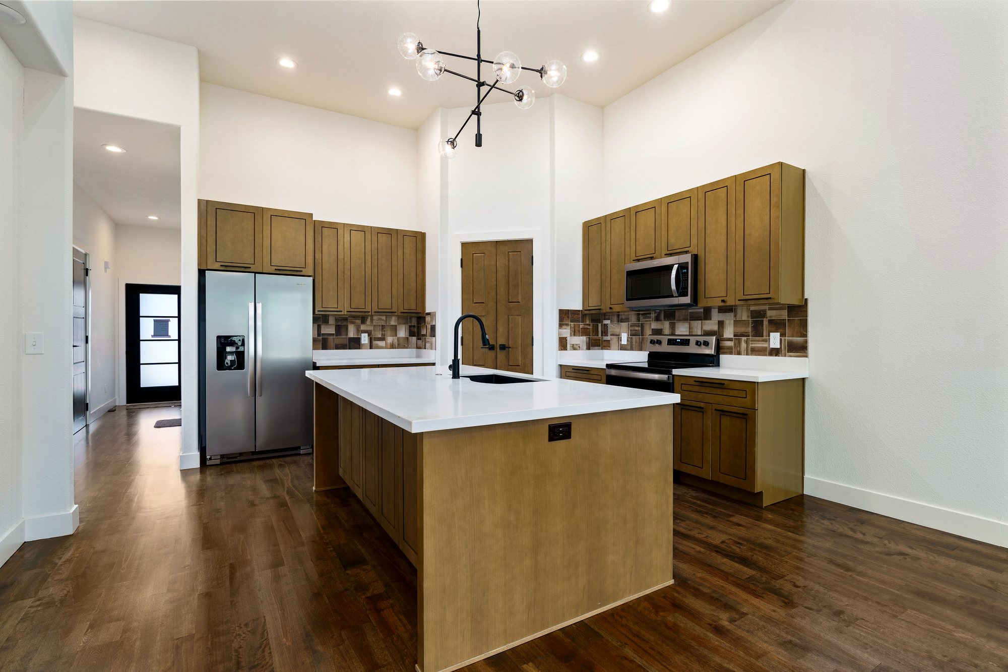 Oak Ridge Farms — stained cabinetry with quartz island